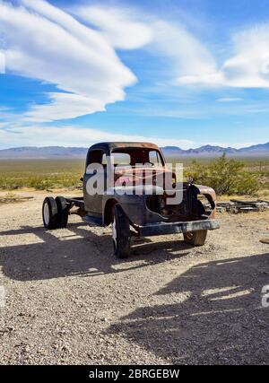 Rhyolite Ghost Town, Beatty Nevada - Rusted out antique automobile. Stock Photo