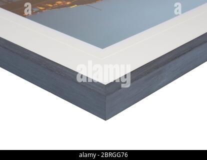 The corner and edge of a high quality wood photo frame complete with mount on a white background. Black picture frames are the most popular choice for Stock Photo