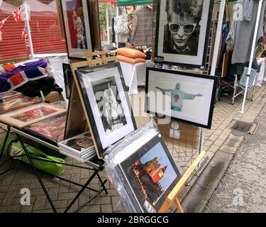 A fine art photography market stall selling framed archive photos of Royalty and celebrity including Princess Diana, David Bowie, HM Queen Elizabeth I Stock Photo