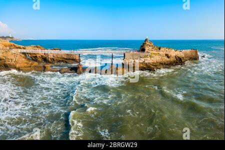 The rock of the Virgin or Le rocher de la Vierge is a tourist natural landmark in Biarritz city in France Stock Photo