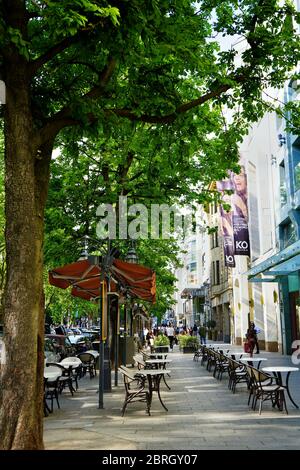 Königsallee, one of Europe's leading upscale shopping boulevards, in the afternoon sun. Its history goes back to the 19th century. Stock Photo