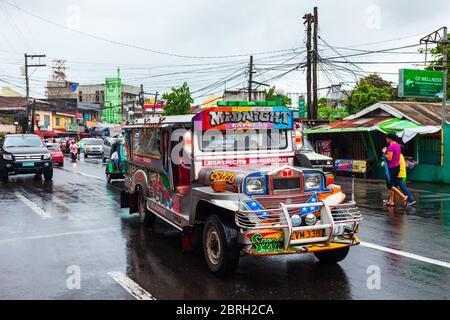 MANILA, PHILIPPINES - FEBRUARY 25, 2013: Jeepneys are popular public transport in the Philippines, they made from old US military jeeps Stock Photo