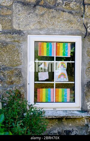 Carona virus awareness and appreciation display in window, NHS rainbow colours Stock Photo
