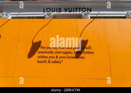 Hopeful messages on the barricade board at storefront of Louis Vuitton SOHO store in the ...