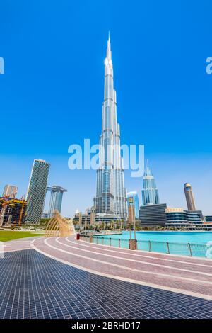 DUBAI, UAE - FEBRUARY 26, 2019: Promenade near the Burj Khalifa Tower and Dubai Mall in Dubai city in United Arab Emirates Stock Photo