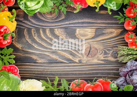 Fresh vegetables on a brown background  on an old wooden table Stock Photo