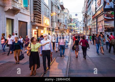 ISTANBUL, TURKEY - SEPTEMBER 22, 2014: Istiklal Avenue or Istiklal Street is one of the most famous pedestrian street in Istanbul, Turkey Stock Photo