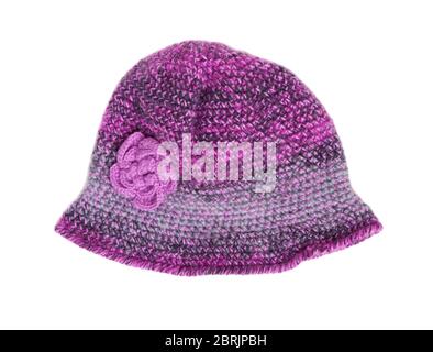 Knitted hat isolated on white background. Winter wool cap. Knit cloth hat with flower. Stock Photo