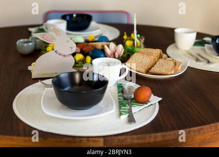 table setting ready for easter breakfast in regular home Stock Photo