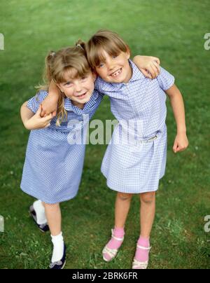 Primary school girls in playground, Surrey, England, United Kingdom Stock Photo