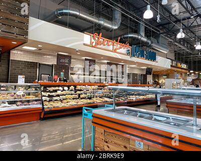 Orlando,FL/USA -5/10/20:  The deli counter of a Whole Foods Market grocery store with colorful sliced meat and cheese and freshly prepared food ready Stock Photo