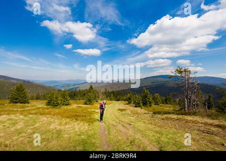 Beautiful panorama with young tourist having trekking trip taken in polish mountains Beskidy on the way to Rysianka through Romanka and Kotarnica duri Stock Photo