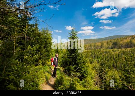 Beautiful panorama with young tourist having trekking trip taken in polish mountains Beskidy on the way to Rysianka through Romanka and Kotarnica duri Stock Photo