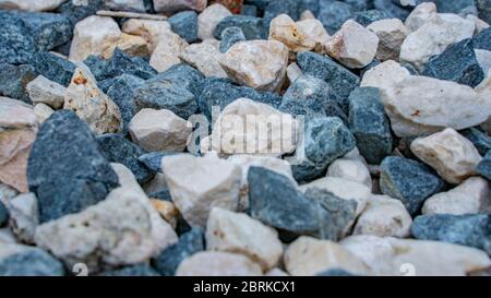 Stone background. blue gravel. Granite texture. The rocky road. Fine pebbles. Construction material. The texture of the stones. Wallpaper with fine gr Stock Photo