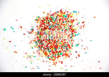 Colorful Hundreds and thousands confectionary isolated on a white background with space for text Stock Photo