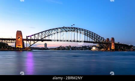 A long exposure of the Sydney Harbour Bridge with smooth water Stock Photo