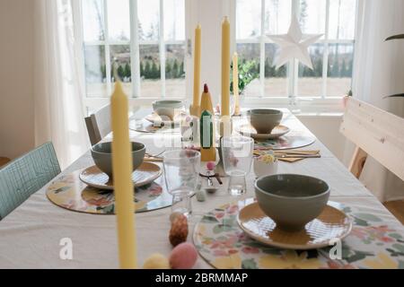 dinner table at home decorated for easter party Stock Photo
