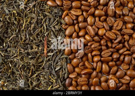 Dry leaves of green tea and fine Roasted coffee beans, top view closeup. Coffee or Green tea concept Stock Photo
