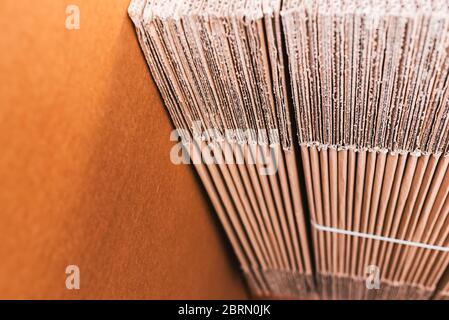 Home moving using corrugated cardboard boxes as protection material, detail. Stock Photo