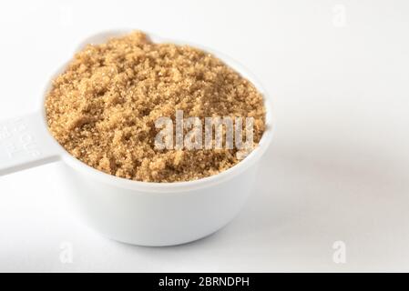 Packed Brown Sugar in a Measuring Cup Stock Photo