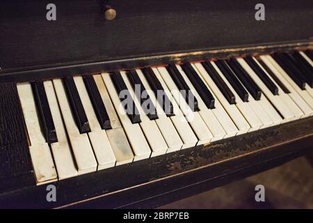 An antique piano keyboard waiting to be played once again. Stock Photo