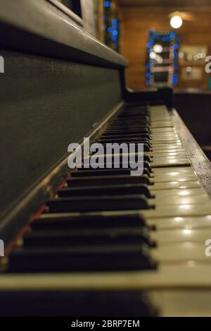 An antique piano keyboard waiting to be played once again. Stock Photo