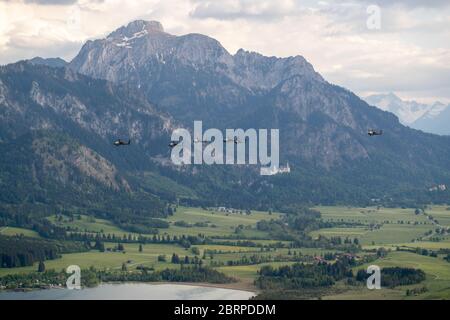 'Apache's flying by Neuschwanstein Castle' Yesterday, 1-3rd Attack Reconnaissance Battalion, 12th Combat Aviation Brigade conducted a battalion training flight of 18 AH-64 Apache attack helicopters. The training mission was an opportunity for 1-3 ARB to conduct a training mission with the full battalion under realistic conditions. The objective area was far enough away to necessitate detailed planning at the company and platoon level. This was a great first step on a progressive training plan to execute collective training. Chinooks from 1-214th Aviation Regiment were also present during the t Stock Photo