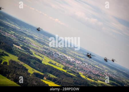 'Delta Formation of Apache's over Germany' Yesterday, 1-3rd Attack Reconnaissance Battalion, 12th Combat Aviation Brigade conducted a battalion training flight of 18 AH-64 Apache attack helicopters. The training mission was an opportunity for 1-3 ARB to conduct a training mission with the full battalion under realistic conditions. The objective area was far enough away to necessitate detailed planning at the company and platoon level. This was a great first step on a progressive training plan to execute collective training. Chinooks from 1-214th Aviation Regiment were also present during the t Stock Photo