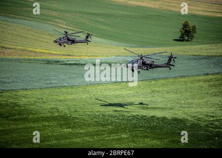 'Apaches hovering in the valley' Yesterday, 1-3rd Attack Reconnaissance Battalion, 12th Combat Aviation Brigade conducted a battalion training flight of 18 AH-64 Apache attack helicopters. The training mission was an opportunity for 1-3 ARB to conduct a training mission with the full battalion under realistic conditions. The objective area was far enough away to necessitate detailed planning at the company and platoon level. This was a great first step on a progressive training plan to execute collective training. Chinooks from 1-214th Aviation Regiment were also present during the training fl Stock Photo