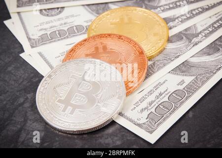 Dollar and bitcoins as symbol of electronic virtual money, choice between traditional paper money and cryptocurrency Stock Photo