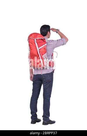 Rear view of asian backpacker man looking at view posing isolated over white background Stock Photo