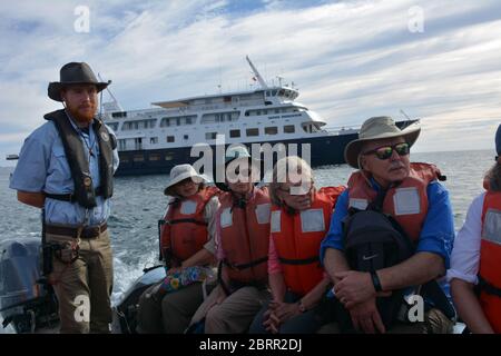 American adventure cruise passengers prepare for a beach rib landing on a remote stretch of land south of Loreto, Baja California Sur, Mexico. Stock Photo