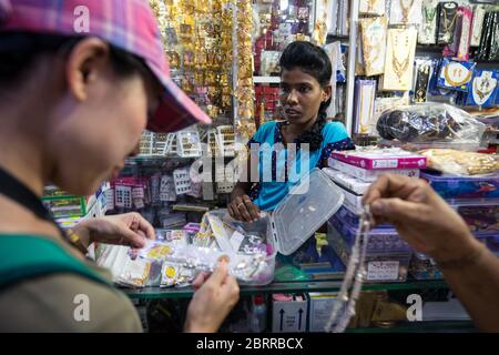 Jaffna / Sri Lanka - August 15, 2019: Asian tourist buying jewels in local jewelery