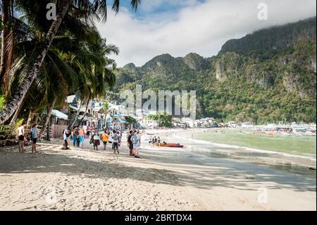 Morning scene at the main beach in El Nido, Philippines as tourists begin to head out on day boats. Stock Photo