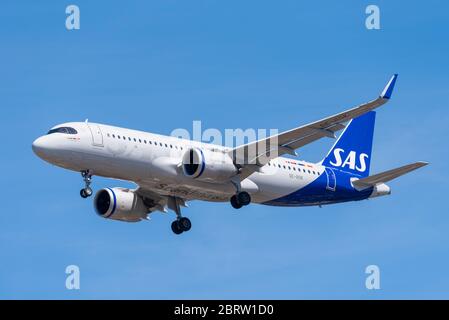 Scandinavian Airlines System Airbus A320 jet airliner plane landing at London Heathrow Airport over Cranford, London, UK during COVID-19 lockdown. Stock Photo