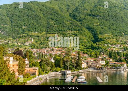 Lenno on Lake Como, Italy, with lakeside villas and lush hillside homes under summer light in Lombardy. Stock Photo