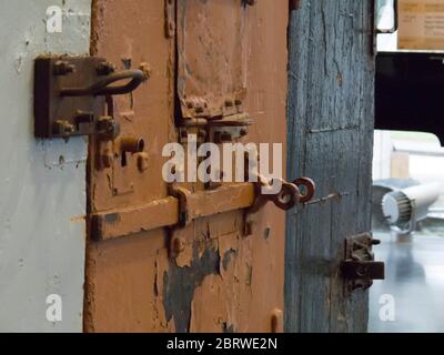 Prison doors with close up of locks and hatches in the museum of communism and occupations and freedom in Tallinn Estonia Stock Photo