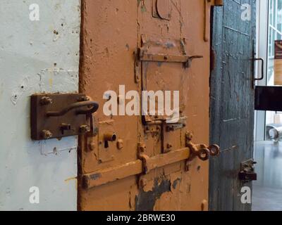 Prison doors with close up of locks and hatches in the museum of communism and occupations and freedom in Tallinn Estonia Stock Photo