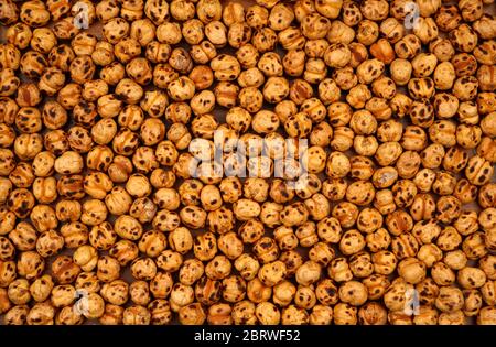 Organic yellow chickpeas. For texture or background. Stock Photo