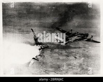 Vintage World War II photograph - B-24H Liberator bomber of 783rd Bomb Squadron, 465th Bomb Group, US 15th Air Force exploding in mid air after being hit by anti-aircraft fire over Germany, 1944 Stock Photo