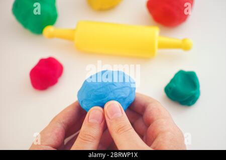 Child Playing Playdough. Close up. Stock Photo