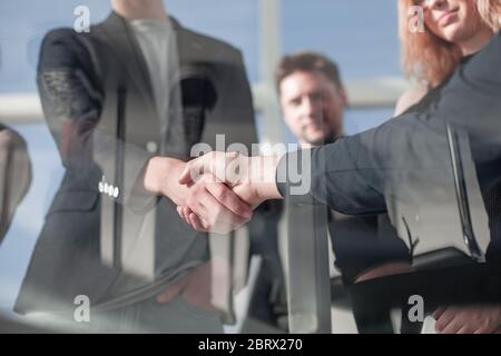 Architect and engineer construction workers shaking hands Stock Photo