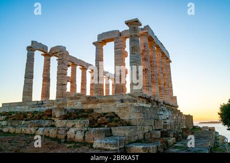 ancient columns of parthenon against blue sky Stock Photo