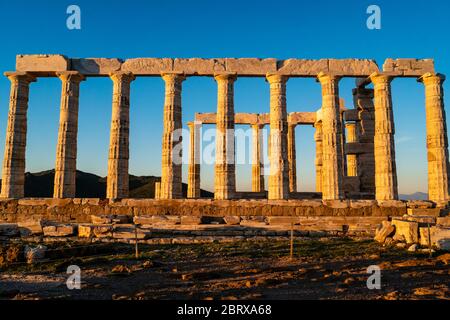 sunshine on ancient columns of parthenon in athens against blue sky Stock Photo