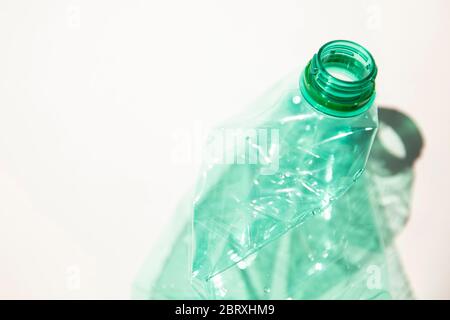 Empty green plastic waste water bottle ready to be recycled. Stock Photo