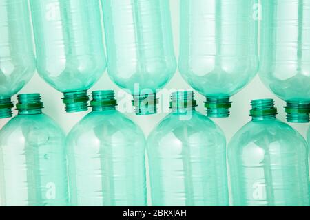 Empty green plastic waste water bottles ready to be recycled. Stock Photo
