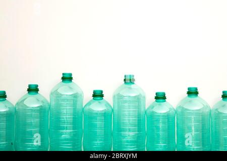 Empty green plastic waste water bottles ready to be recycled. Stock Photo
