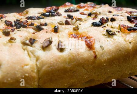 Freshly baked homemade Italian focaccia bread, a flat oven-baked Italian bread product, similar in style and texture to pizza dough. Stock Photo