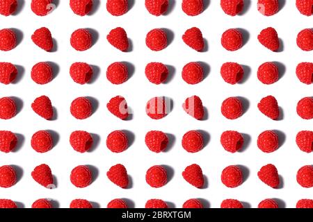 Pattern made of fresh summer raspberry isolated on white. Top view. Stock Photo