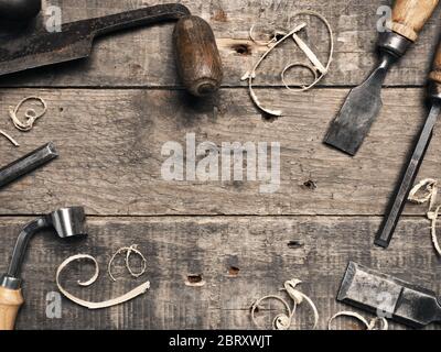 Carpenter tools on a rustic wooden background with space for text Stock Photo